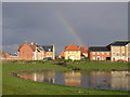 Tayfen estate and lake with rainbow