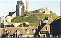 SY9681 : Corfe Castle Rises over the Village Rooftops by Sarah Charlesworth