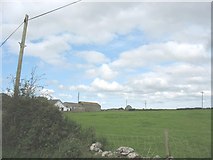 SH4680 : Farm buildings and bungalow at Erddreiniog viewed across pasture land by Eric Jones
