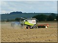 SU1078 : Harvesting wheat, north of Broad Hinton, Wiltshire by Brian Robert Marshall