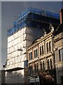 Shrouded hotel and adjacent buildings, Queen Street, Exeter