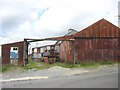 Colourful old corrugated-iron garages near Y Dreflan