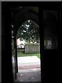 Looking out into the churchyard from the porch of St Andrew