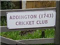 Sign on gate to the entrance to Addington Cricket Ground