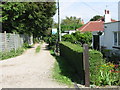 Three bungalows on a track off Roman Road