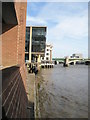 Looking along the River Thames towards Southwark Bridge from Stew Lane