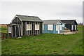NU2612 : Beach huts by Helen Wilkinson