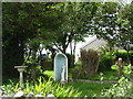 SH3881 : A peaceful garden opposite Llechcynfarwy Church by Eric Jones